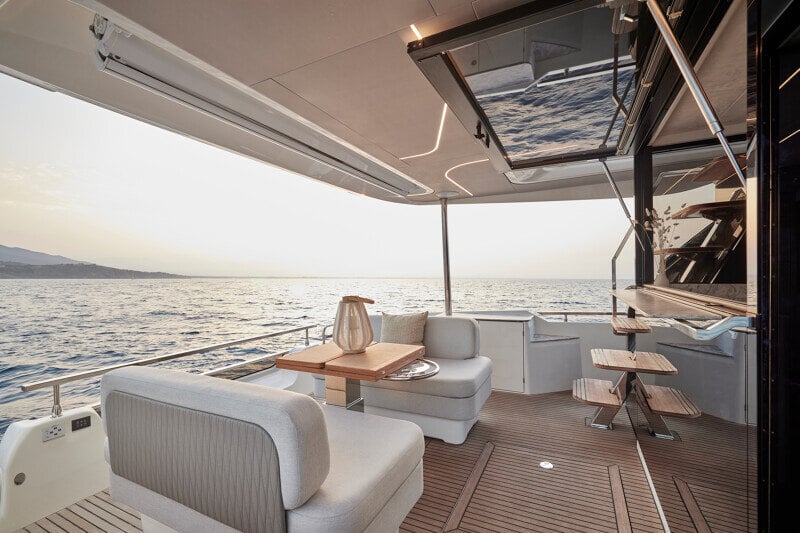 Prestige F5.7’s aft deck designed for socializing with a bar and seating.