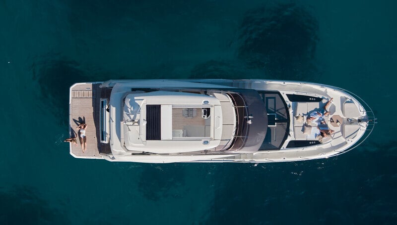 Prestige F5.7’s flybridge designed for socializing with a bar and seating.