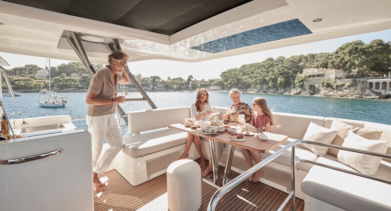 Prestige F5.7’s flybridge designed for socializing with a bar and seating.