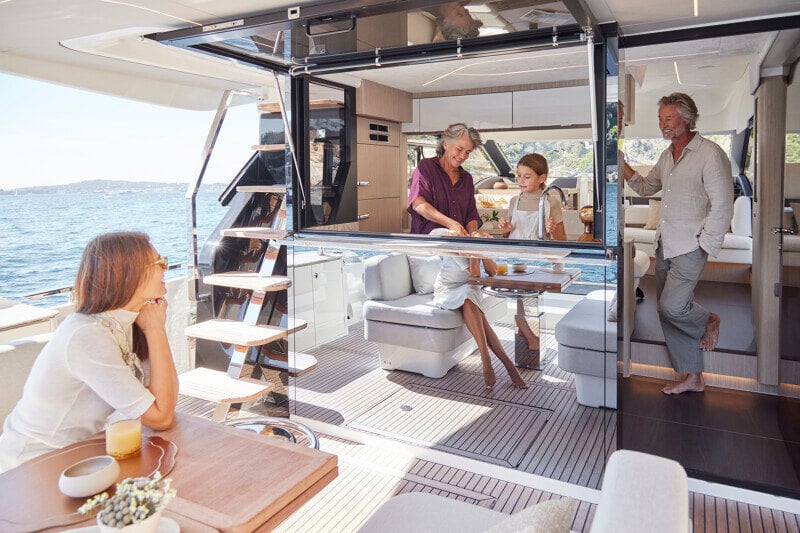 Aft deck dining table on the Prestige F5.7 set for a gourmet meal.