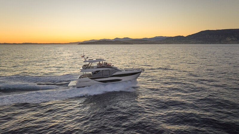 Luxury Prestige F5.7 yacht gliding smoothly on open waters.
