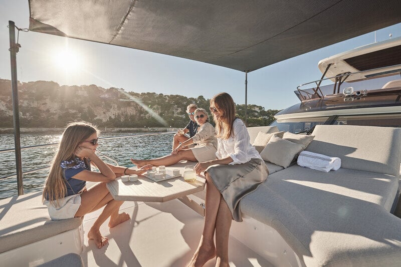Elegant bow seating area on the Prestige F5.7, perfect for sunbathing.